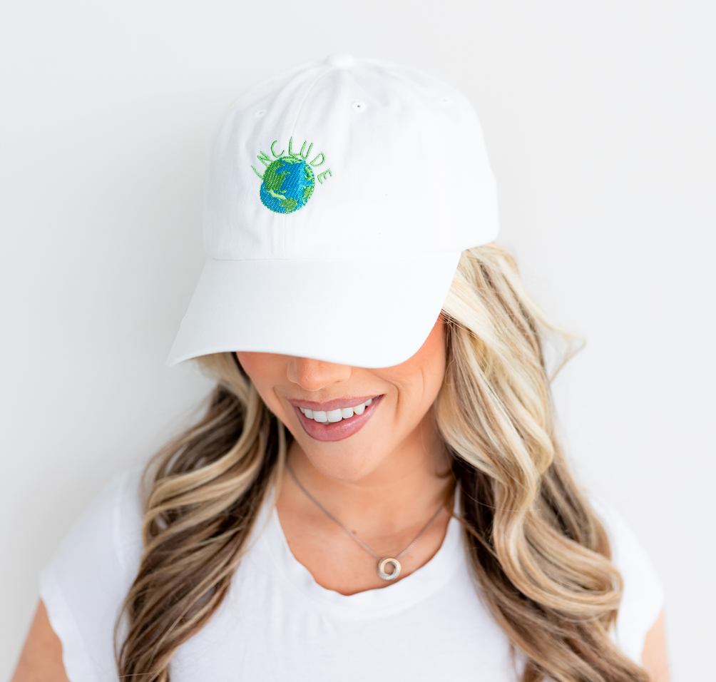 Female model wearing Maximizer Joes "Include" white hat