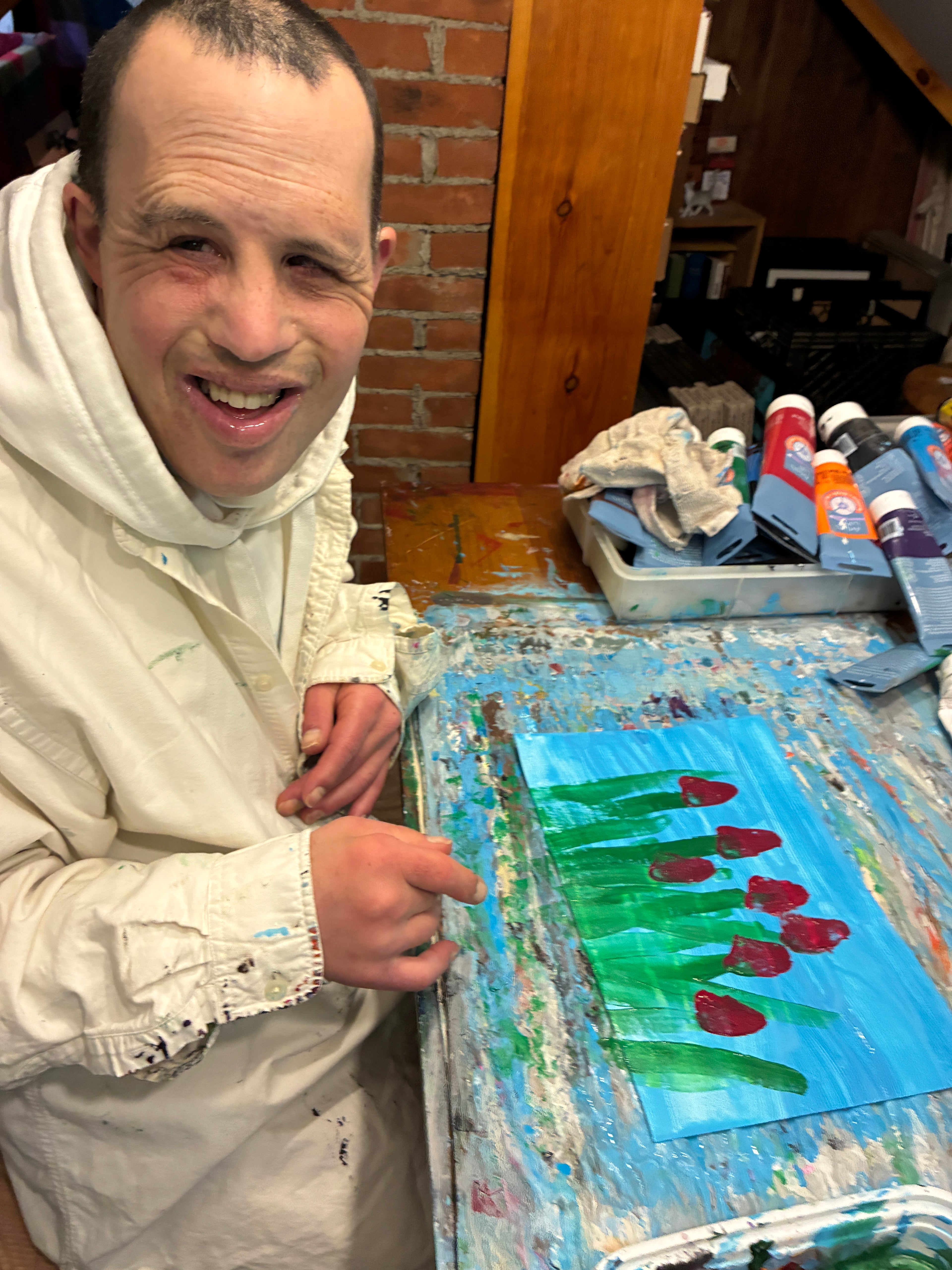 Maximizer Adam painting flowers
